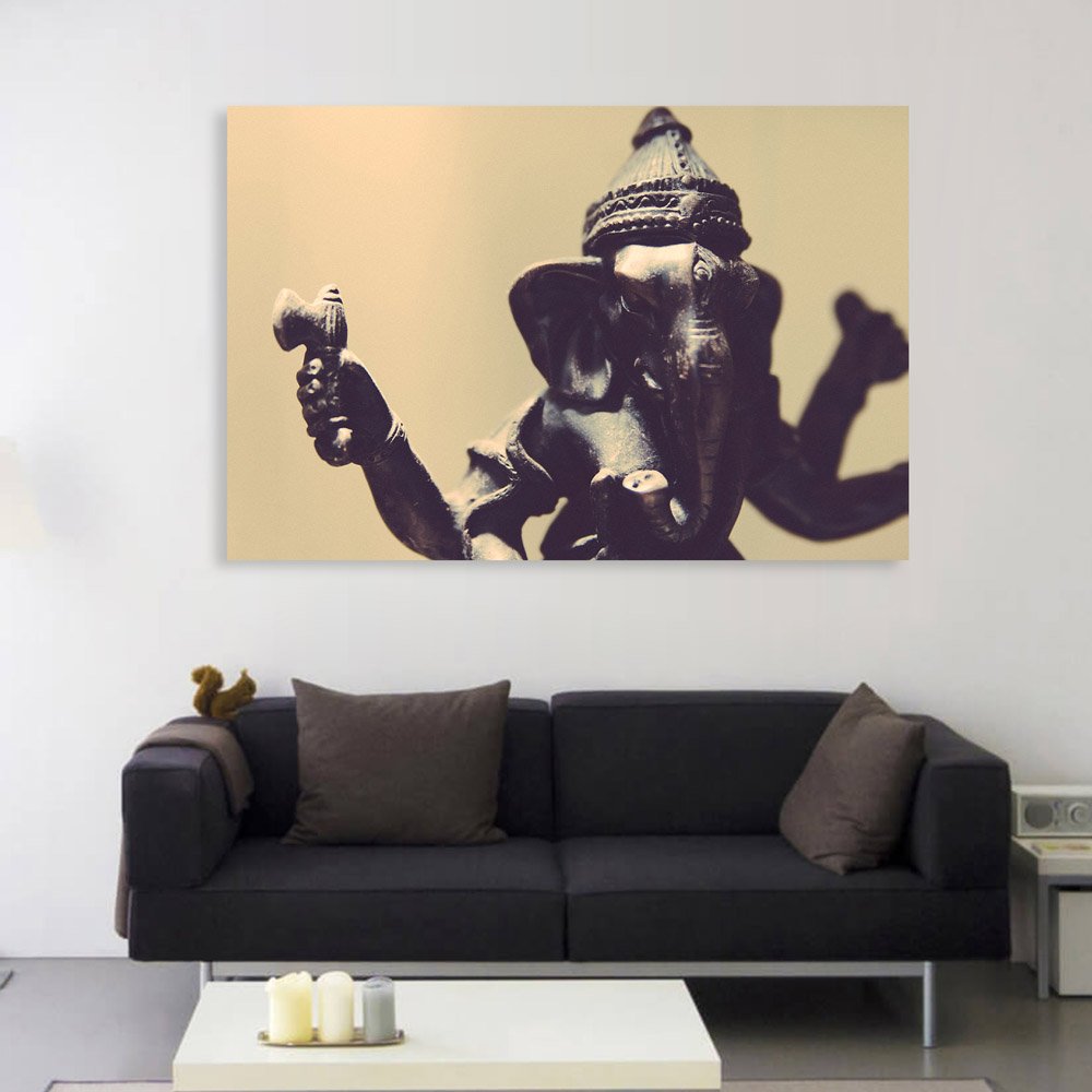 inep-b07czt7v8k-ganesha-tastic-unframed-canvas-that-blesses-your-walls-displayed-on-a-white-living-room-wall-under-warm-lighting..jpg